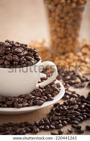 Many kinds of coffee beans on sackcloth.