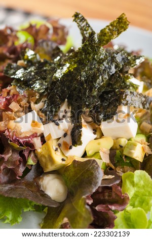 Japanese salad with tofu, avocado, seaweed and wasabi mayonnaise