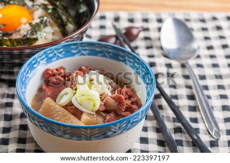 Japanese style beef stewed with rice and preserved egg yolk