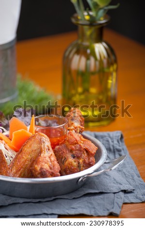 Fried chicken with vegetable in steel bowl.