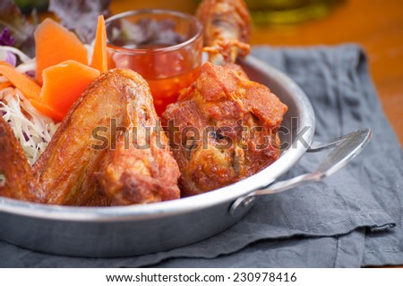 Fried chicken with vegetable in steel bowl.