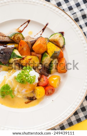 Roasted vegetables with posh egg with balsamic and hollandaise sauce