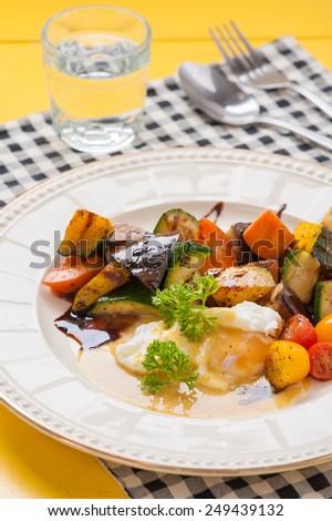 Roasted vegetables with posh egg with balsamic and hollandaise sauce