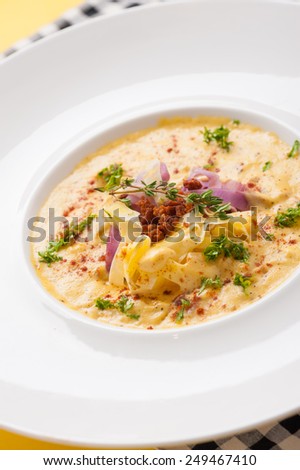 Pasta carbonara in white dish, pasta made from sweet potato, vegetarian food