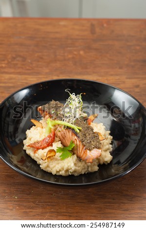 White wine lemon-sage risotto and sundried tomato with cured salmon tapenade, european fusion food