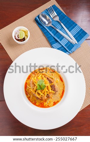 Yellow noodles (Khao Soi) with fried pork, Fusion food