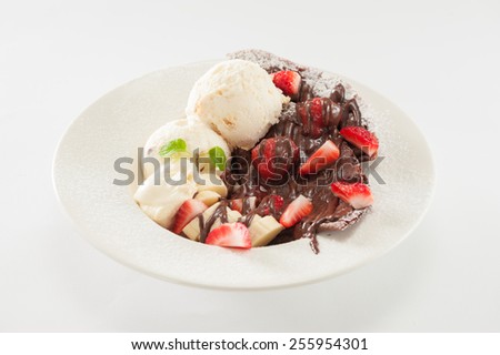 Gelato ice cream with crepe, chocolate sauce and fruits