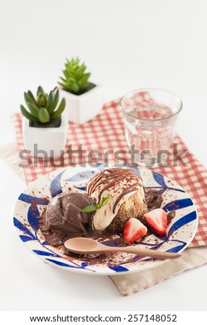 Chocolate ice cream with Tiramisu (Italian dessert) and strawberries.