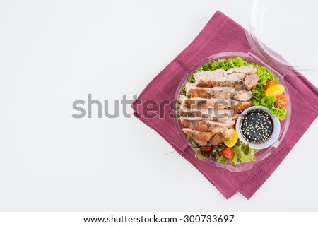 Grilled pork and teriyaki sauce (Japanese sweet sauce) cooked by clean food concept with salad in lunch box