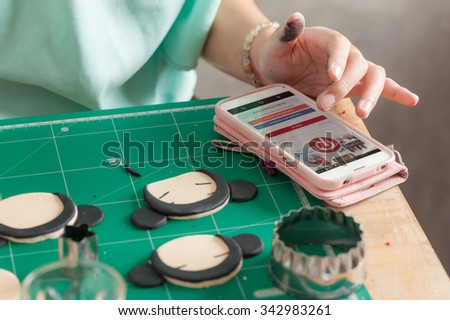 CHIANG MAI, THAILAND - NOVEMBER 24,2015: Woman using Pinterest app on smart phone to find some idea, Pinterest is a pinboard-style application for sharing photo, interests, or hobbies