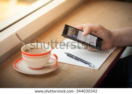 CHIANG MAI, THAILAND - NOVEMBER 25,2015: Man using Facebook app on Android smart phone. Facebook is the most popular social networking site in the world.