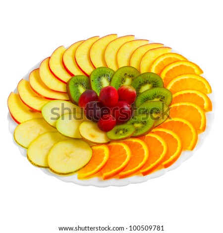 Salad of apples oranges grapes kiwi fruit slices on a plate isolated ...