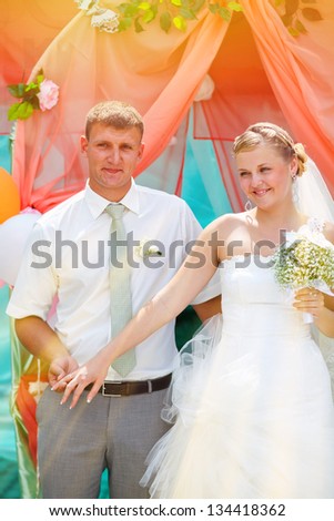 sunlight Bride and groom newlyweds are on the register ceremony content and cheerful smile