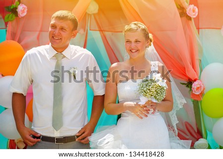 sunlight Bride and groom newlyweds are on the register content and cheerful smile