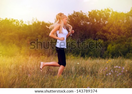 fitness sport woman blonde running runner girl nature lifestyle female exercise healthy young run