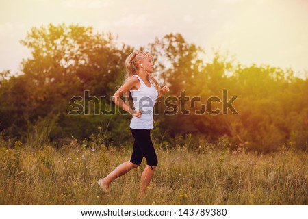 fitness woman sport blonde running runner girl nature lifestyle female exercise healthy young run