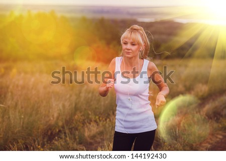 sunlight fitness sport girl blonde woman running runner nature lifestyle female exercise healthy young run