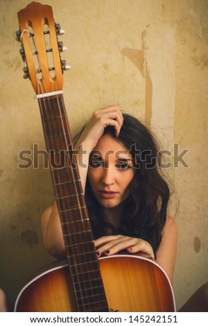 beautiful young adult nude woman holding an acoustic guitar art vintage photo