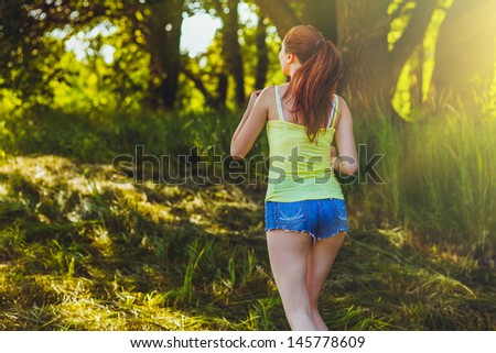 sunlight woman young brunette runner running back view outdoors, prospect healthy lifestyle, fitness sports