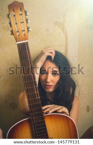 sunlight beautiful young adult nude woman holding an acoustic guitar art vintage photo