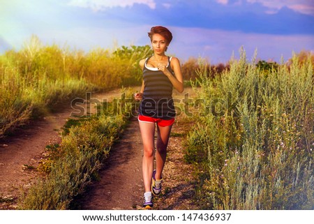 sunlight beautiful healthy runs young brunette a woman athlete running outdoors, fitness and healthy lifestyle, running