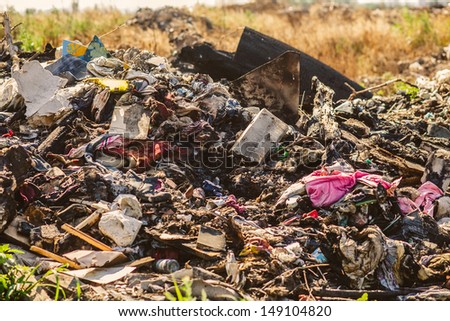 large pile of debris, city dump, pollution
