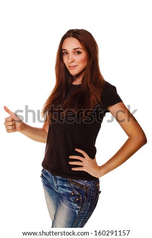 happy young woman girl shows positive sign thumbs yes, in a gray T-shirt and blue jeans isolated