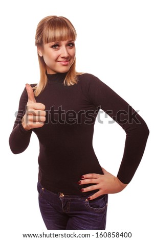 happy young woman girl shows positive studio sign thumbs yes, in black T-shirt and jeans isolated