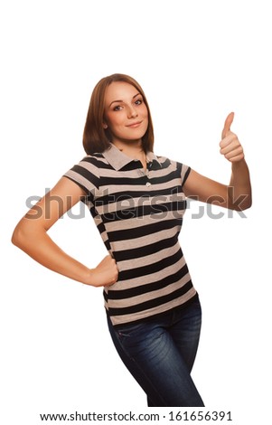 portrait happy woman young girl shows positive sign thumbs yes, in striped t-shirt isolated