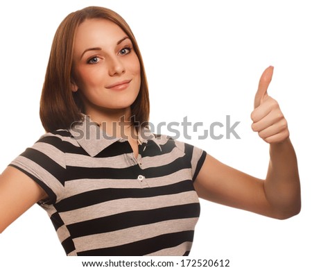 portrait happy woman young girl shows positive sign thumbs yes, in striped t-shirt isolated large