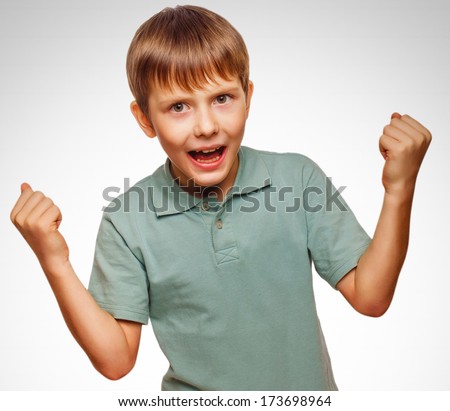 teen excited happy teenage boy shows his hand so his fists emotions isolated on white background gray large