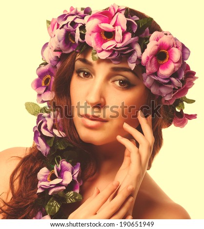 beauty model beautiful woman face close-up , wreath flowers her head isolated large cross processing retro