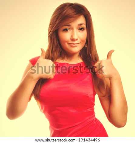 brunette girl yes woman shows positive sign thumbs isolated emotion gray large cross processing retro