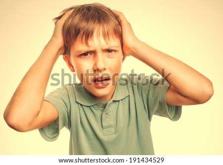 Boy child man upset angry shout produces evil face portrait isolated emotion gray large cross processing retro
