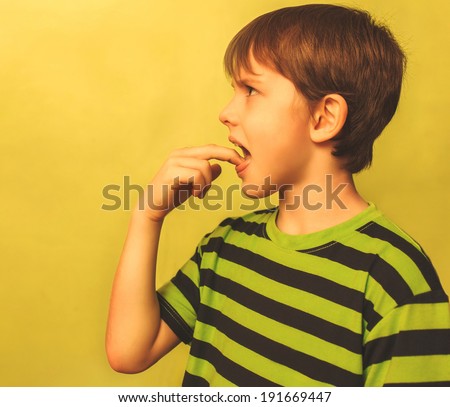 kid boy teenager baby poisoning vomiting belching, anorexia fingers in mouth burps on green background large cross processing retro