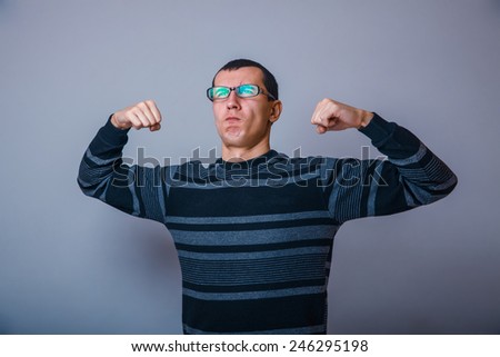 European-looking male of about thirty brunet shows muscle strength