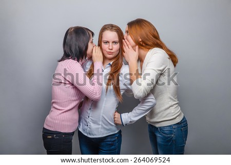 three female  woman woman  friends girl gossip rumors surprise surprise on a gray background
