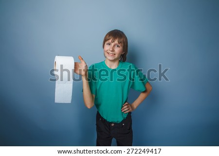 European appearance boy brown teenager in a green T-shirt holdin
