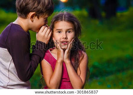 boy girl whispers in the ear secret rumors raskazyvaet in nature photos