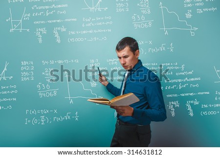 scientist professor teacher a man holding a book pointing to whiteboard with math formulas and objectives infographics studio photo
