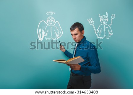 man holding a book showing an angel and devil demon infographics infographics Bible study of religion