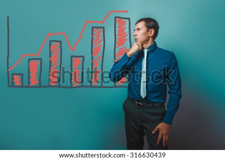 businessman man thinking looking away holding his chin growth graph up Business strategy infographics studio blue background