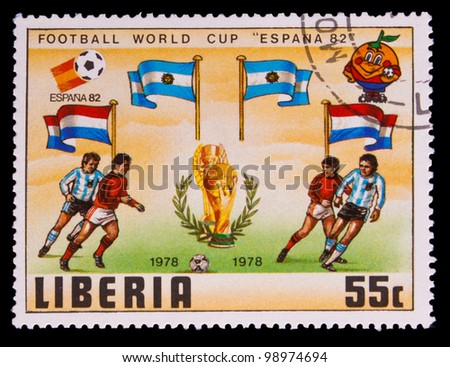 LIBERIA - CIRCA 1982: A post stamp printed LIBERIA, Argentina, Netherlands Flags of World Cup Soccer Cup FIFA World Cup 82 Trophy Coupe du Monde, circa 1982