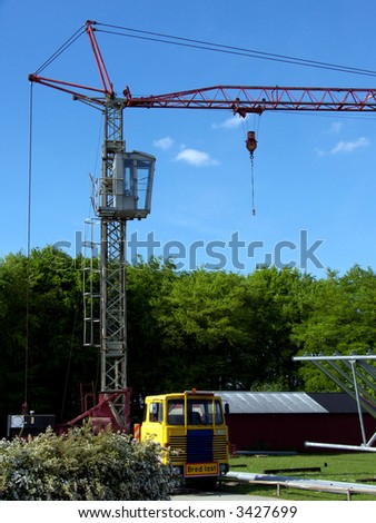 portrait of old mobile crane at construction site