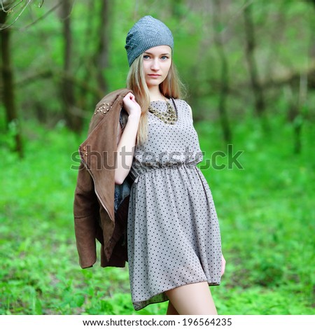 Closeup portrait of romantic fashion young woman smile in the woods.
