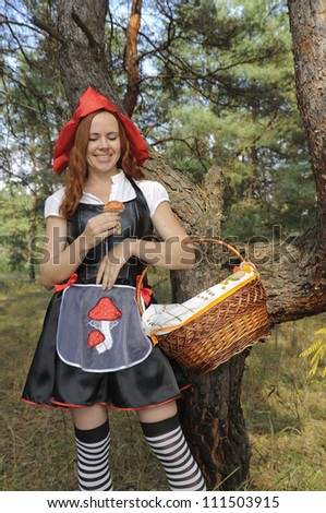 Red Riding Hood. The picture of Red Riding Hood going to outwit the Wolf with fly-agaric mushroom.
