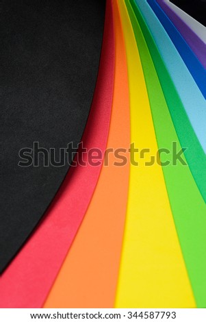 Thin sheets of multicolored cellular rubber arranged into iridescent shape