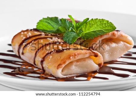 pancake rolls with chocolate caramel topping decoration