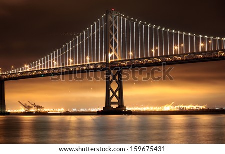 New Lights Illuminate The Bay Bridge Connecting San Francisco And Oakland Over San Francisco Bay In California.
