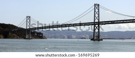 The Bay Bridge spans San Francisco Bay to connect the cities of San Francisco and Oakland.